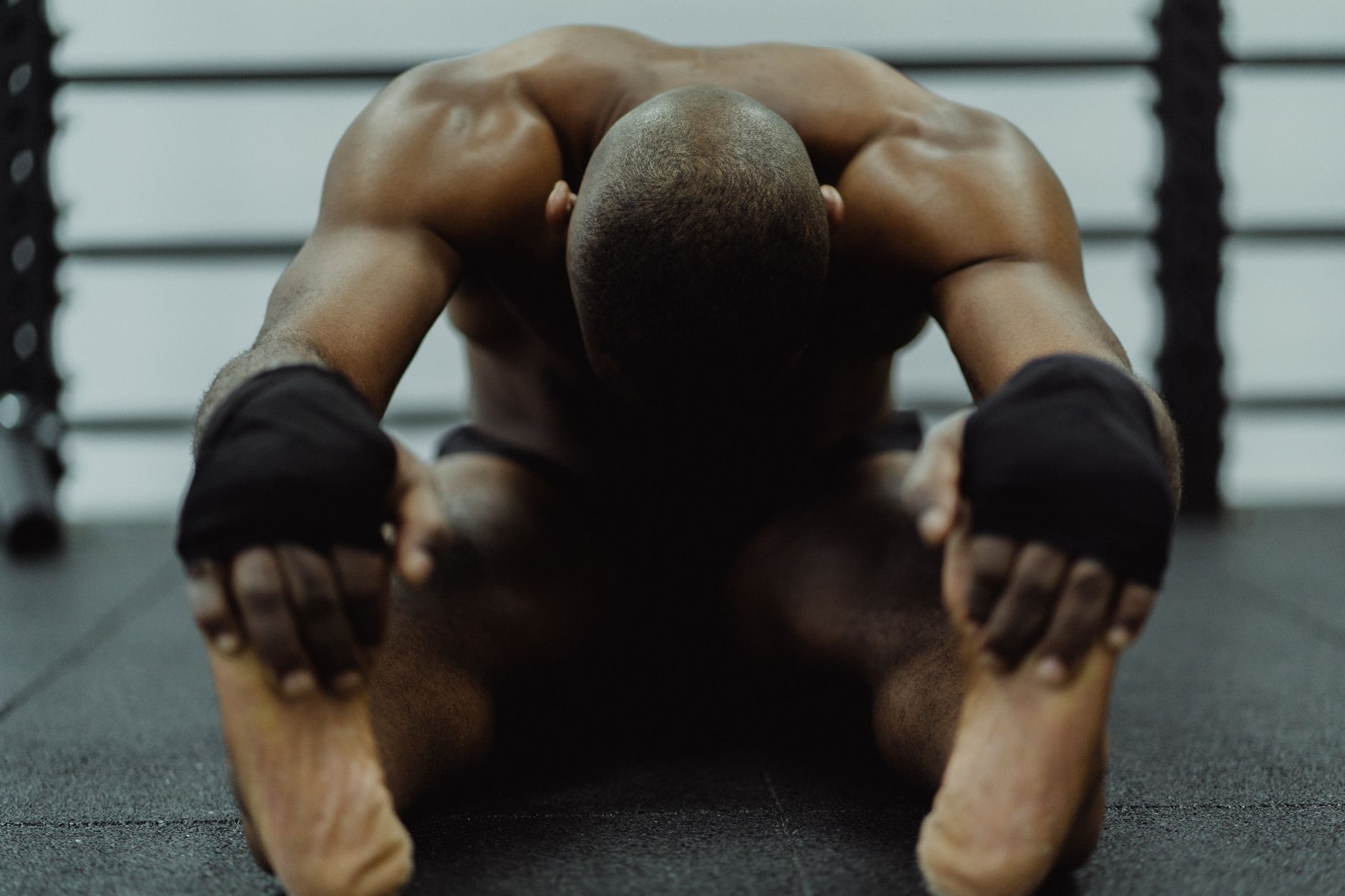 Athlete stretching during recovery work for Best readiness score app for endurance training.