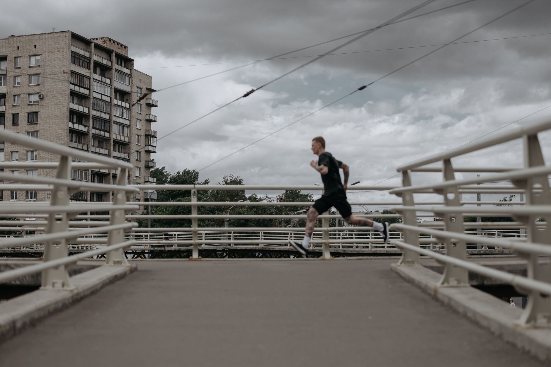 Runner training outdoors for Best Apple Watch workout app for concise cues.